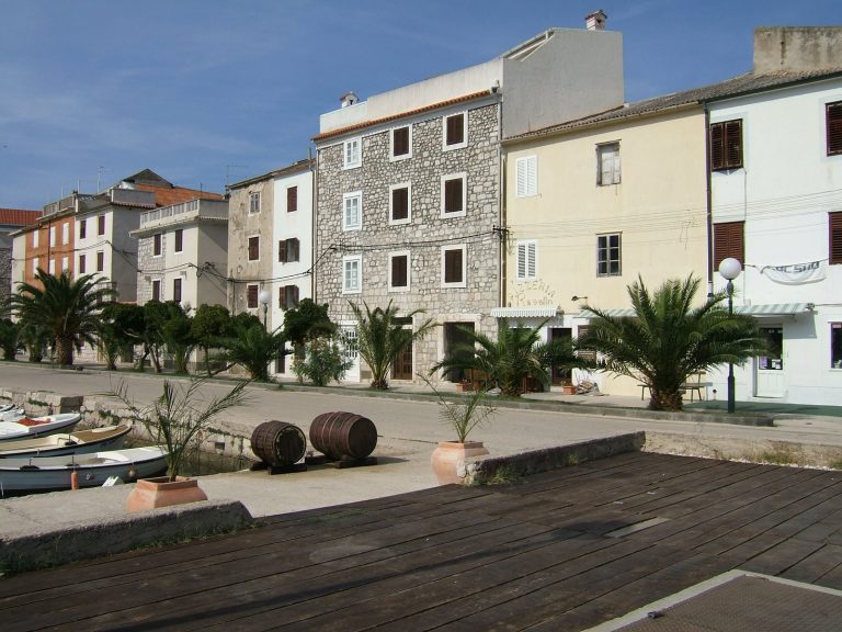 Stone houses along the harbour in Pag town