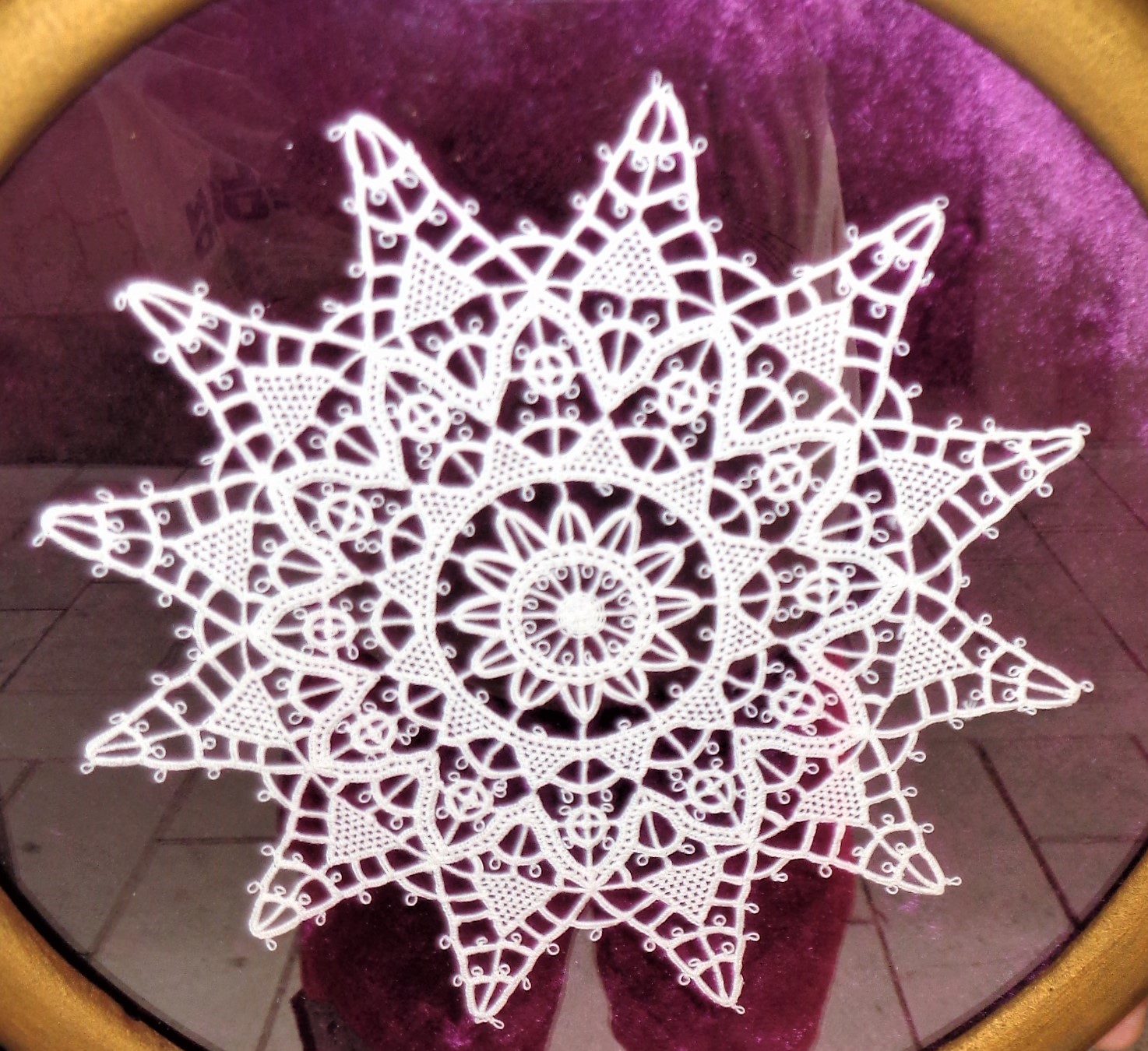 A framed piece of Pag lace (paska cipka)